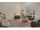 Cozy living room with a fireplace, plush furniture, and a large window, offering a relaxing space at 9836 Banner Peak St, Littleton, CO 80125