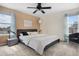 Bedroom with a neutral color palette, ceiling fan, and natural light at 873 Mockingbird St, Brighton, CO 80601