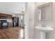 View of the kitchen with dark cabinetry and a stainless steel refrigerator at 873 Mockingbird St, Brighton, CO 80601