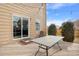 Cozy patio with table, chairs, nice landscaping, and sliding glass door to home at 873 Mockingbird St, Brighton, CO 80601