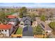 This aerial view captures a modern home, solar panels, and city views at 2610 N Monroe St, Denver, CO 80205