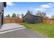 Private backyard with a well-maintained lawn, patio area, and fenced perimeter for outdoor activities and relaxation at 2610 N Monroe St, Denver, CO 80205