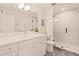 Modern bathroom featuring glass enclosed shower, sleek vanity with a spacious mirror, and contemporary design at 2610 N Monroe St, Denver, CO 80205