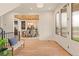 Welcoming entryway features natural light, modern bench seating, and views into the adjacent dining room at 2610 N Monroe St, Denver, CO 80205
