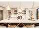 Bright, modern kitchen with marble countertops, stainless steel appliances, and stylish pendant lighting at 2610 N Monroe St, Denver, CO 80205