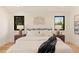 Stylish main bedroom featuring an inviting bed, side tables, and ample natural light at 2610 N Monroe St, Denver, CO 80205
