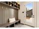 Charming mudroom with a bench, storage cubbies, and access to the backyard, offering a practical and stylish entryway at 2610 N Monroe St, Denver, CO 80205