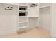 Spacious walk-in closet with custom shelving and ample storage space for clothes and accessories at 2610 N Monroe St, Denver, CO 80205