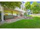Backyard with a hot tub and a fire pit area, providing an ideal space for relaxation and entertaining at 9465 W 77Th Dr, Arvada, CO 80005