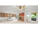 Basement with fireplace, walkout access to the exterior and built-in shelving at 9465 W 77Th Dr, Arvada, CO 80005