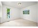 Bright bedroom showcases a window with verdant view and a serene painting, enhancing its appeal at 9465 W 77Th Dr, Arvada, CO 80005