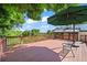 Expansive deck features an outdoor seating area, stunning views, and plenty of space for entertaining at 9465 W 77Th Dr, Arvada, CO 80005