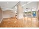 Sun-drenched living area with parquet floors, beamed ceilings, and an abundance of natural light at 9465 W 77Th Dr, Arvada, CO 80005