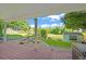 Back patio with a fire pit and seating area providing an ideal space for outdoor gatherings and relaxation at 9465 W 77Th Dr, Arvada, CO 80005