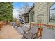 Inviting backyard deck with patio furniture and umbrella at 19080 E Low Cir, Aurora, CO 80015