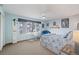Bedroom with light blue walls, a ceiling fan, and a large window with blinds at 19080 E Low Cir, Aurora, CO 80015