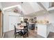 Bright, airy kitchen with white cabinets, granite countertops, stainless steel appliances, and a breakfast nook with skylights at 19080 E Low Cir, Aurora, CO 80015