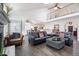 Spacious living room with hardwood floors, vaulted ceilings, a fireplace, and a comfortable seating arrangement at 19080 E Low Cir, Aurora, CO 80015