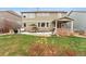 Expansive backyard with lush grass, a patio, and outdoor dining, ideal for entertaining and Gathering gatherings at 17748 W 95Th Ave, Arvada, CO 80007