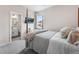 Comfortable bedroom with a TV, four poster bed and access to an ensuite bathroom at 17748 W 95Th Ave, Arvada, CO 80007