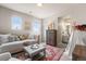 Comfortable bedroom with a day bed, area rug and access to an ensuite bathroom at 17748 W 95Th Ave, Arvada, CO 80007