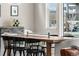 Bright dining room featuring hardwood floors, modern decor, and a sun-filled window at 17748 W 95Th Ave, Arvada, CO 80007