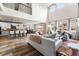 Spacious living room featuring high ceilings, natural light, an open floor plan, and stylish modern decor at 17748 W 95Th Ave, Arvada, CO 80007