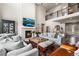 Well-designed living room featuring high ceilings, fireplace, large windows and open floor plan at 17748 W 95Th Ave, Arvada, CO 80007