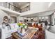 Bright open-concept living area featuring a modern kitchen, dining area, and stylish furnishings at 17748 W 95Th Ave, Arvada, CO 80007