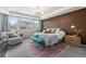 Cozy main bedroom featuring natural light, plush bedding, and stylish decor at 17748 W 95Th Ave, Arvada, CO 80007