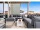 Inviting outdoor patio with comfortable seating around a modern fire pit, perfect for relaxing evenings at 17748 W 95Th Ave, Arvada, CO 80007