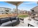 Relaxing patio with plush seating and a cooler, offering a cozy spot to enjoy outdoor living at 17748 W 95Th Ave, Arvada, CO 80007