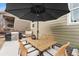 Charming patio with a dining table and wicker chairs, creating a cozy spot for outdoor meals and gatherings at 17748 W 95Th Ave, Arvada, CO 80007