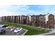 Modern townhomes with mixed brick and siding exterior, individual balconies, and attractive landscaping at 4 Ascent Trl, Englewood, CO 80112