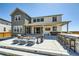 Beautiful backyard featuring a patio with a fire pit, outdoor seating, and a built-in bar at 6255 Kenzie Cir, Castle Pines, CO 80108
