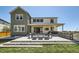 Backyard with outdoor seating, a patio with a fire pit, and a built-in bar at 6255 Kenzie Cir, Castle Pines, CO 80108