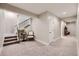 Finished basement with carpet, stairs and trim at 6255 Kenzie Cir, Castle Pines, CO 80108