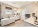 Sleek bathroom with a soaking tub, double vanity, and modern fixtures at 6255 Kenzie Cir, Castle Pines, CO 80108