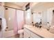 Bathroom with a shower/tub combo, and a single sink vanity at 6255 Kenzie Cir, Castle Pines, CO 80108