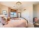 Bedroom featuring a chandelier, a full-sized bed, and neutral walls at 6255 Kenzie Cir, Castle Pines, CO 80108