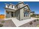 Inviting home exterior featuring a covered porch, stone accents, and a neatly landscaped yard at 6255 Kenzie Cir, Castle Pines, CO 80108