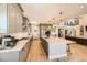 Large open kitchen with granite countertops, stainless appliances and hardwood floors at 6255 Kenzie Cir, Castle Pines, CO 80108