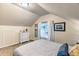 Bedroom offering window views, sloped ceiling, dresser, decorative mirror, and stylish wall art at 7559 S Turkey Creek Rd, Morrison, CO 80465