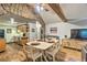 Open-concept dining and kitchen area with stone accents and modern appliances at 7559 S Turkey Creek Rd, Morrison, CO 80465