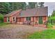 Charming single-Gathering home with a mix of wood and stone exterior, covered entry, and forested surroundings at 7559 S Turkey Creek Rd, Morrison, CO 80465