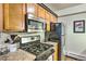 Well-equipped kitchen with stainless steel appliances and tile backsplash, perfect for the aspiring home chef at 7559 S Turkey Creek Rd, Morrison, CO 80465