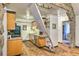 Kitchen featuring a modern ladder to loft, providing a unique feature and access to additional space above at 7559 S Turkey Creek Rd, Morrison, CO 80465