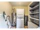 Functional laundry room with modern washer and dryer units and ample storage solutions at 7559 S Turkey Creek Rd, Morrison, CO 80465