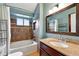 Updated bathroom boasts granite counters, modern vanity, and tiled shower over tub at 1280 W 134Th Pl, Westminster, CO 80234
