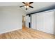 Bedroom featuring wood floors, a double closet and access to the bathroom at 1280 W 134Th Pl, Westminster, CO 80234